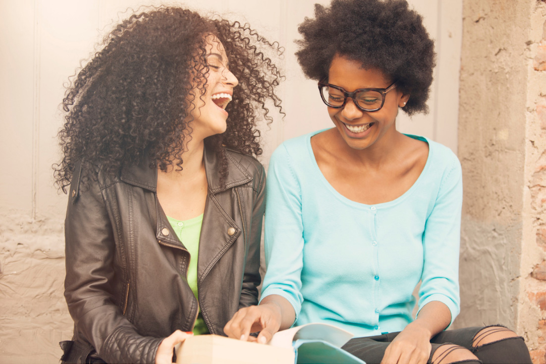 two women laughing